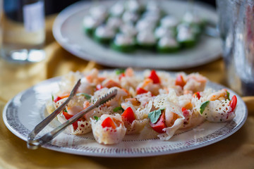 Beautifully decorated catering banquet table with different food snacks and appetizers on event
