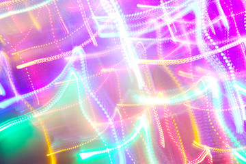 Chaotic lights in moriol blur out of focus - abstract photograph background.