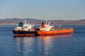 Fototapeta premium Black and Orange Tankers in Gibralter