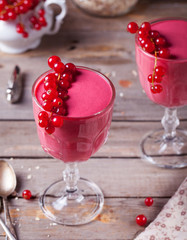 Smoothie, dessert with raspberry in glasses.