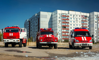 three red fire truck .