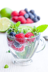 Detox  water. Homemade summer fruit drink with raspberry and blu