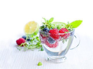Detox  water. Homemade summer fruit drink with raspberry and blu