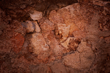 Red and brown rough stone surface