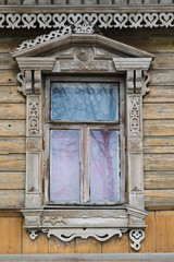 Carved window of old wooden house