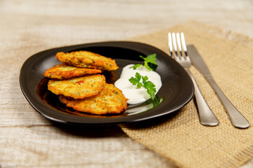 Potato pancakes with sour cream and parsley
