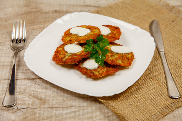 Potato pancakes with sour cream and parsley