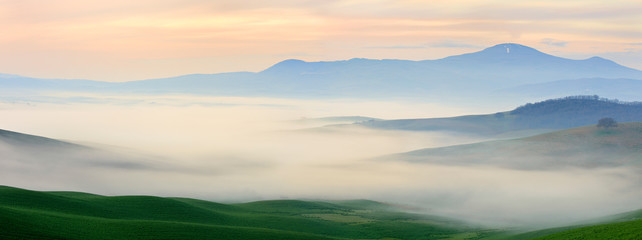 Fototapeta na wymiar Tuscany Landscape at Sunrise, Morning Fog, Val d’Orcia, Tuscany, Italy