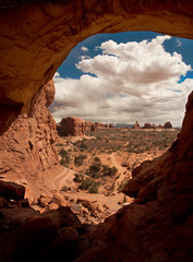 Looking through Arch formation to distant desert