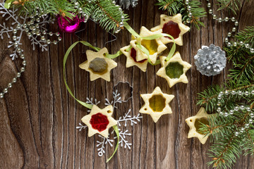 Fototapeta premium Christmas gift homemade biscuits star on the holiday table, copy