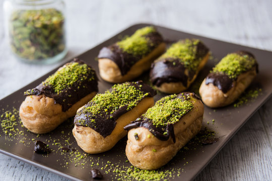Chocolate Eclairs / Donut with pistachio powder.