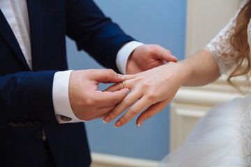 Bride and groom's hands with wedding rings