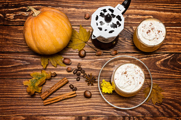 pumpkin spice latte with whipped cream and pumpkin, top view