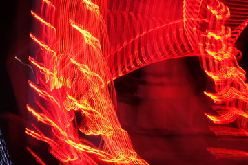 Chaotic lights in moriol blur out of focus - abstract photograph background.
