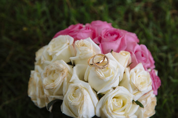 Gold rings on wedding bouquet