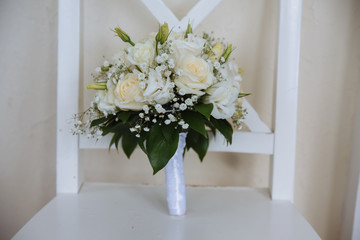 Fototapeta na wymiar Wedding bouquet with white flowers on background