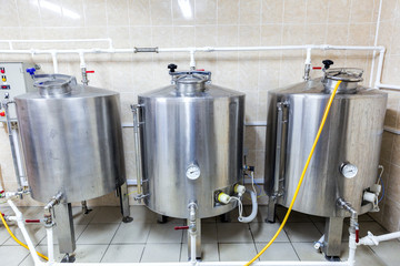Row of tanks in brewery