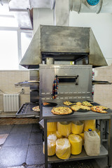 Industrial oven for baking pizza. Kitchen Pizzeria