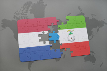 puzzle with the national flag of netherlands and equatorial guinea on a world map background.