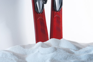 Closeup of A Pair of Skis Behind Heap of Snow