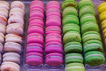 Showcases with colorful makarons