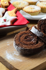 Chocolate Christmas Yule Log, Biscuits and Mince Pies on Table