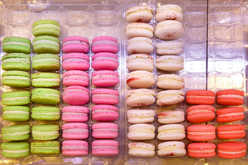 Showcases with colorful makarons