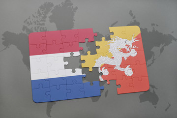 puzzle with the national flag of netherlands and bhutan on a world map background.