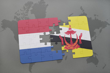 puzzle with the national flag of netherlands and brunei on a world map background.
