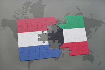 puzzle with the national flag of netherlands and kuwait on a world map background.