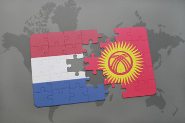 puzzle with the national flag of netherlands and kyrgyzstan on a world map background.