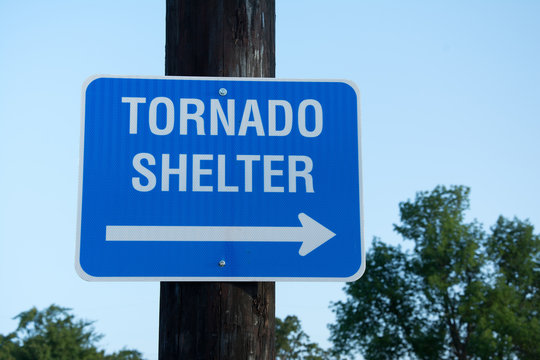 Tornado shelter sign to guide people to safety in tornado emergency