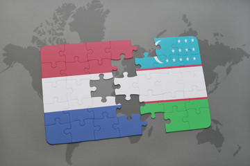 puzzle with the national flag of netherlands and uzbekistan on a world map background.