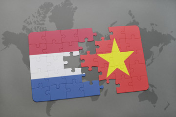 puzzle with the national flag of netherlands and vietnam on a world map background.