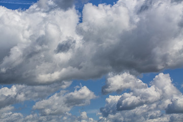 Naklejka premium blue sky background with white clouds