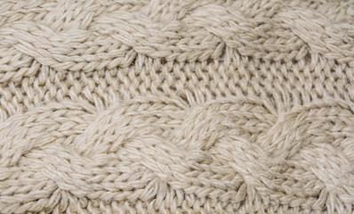 Fragment of knitting patterns. Artificial wool.