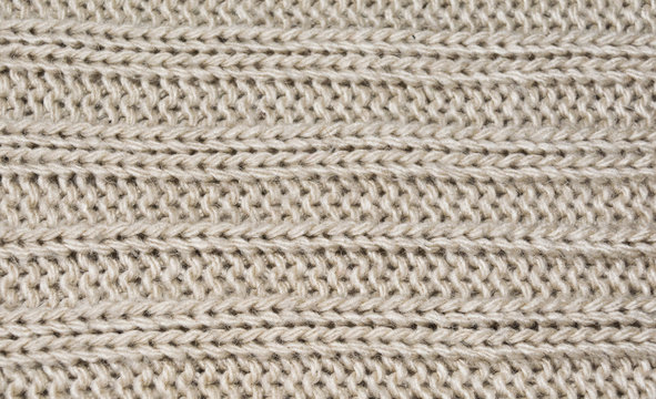 The texture of wool material with a longitudinal pattern.