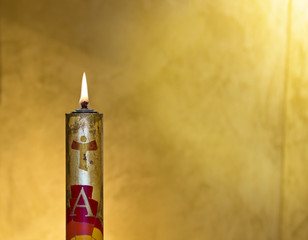 Easter candle welcomes the light of the holy spirit