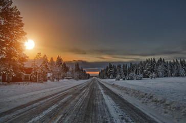 Obraz premium Sunset over road, Lapland Finland