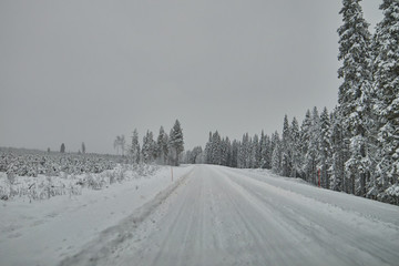 Fototapeta na wymiar Road in Finland after snow blizzard
