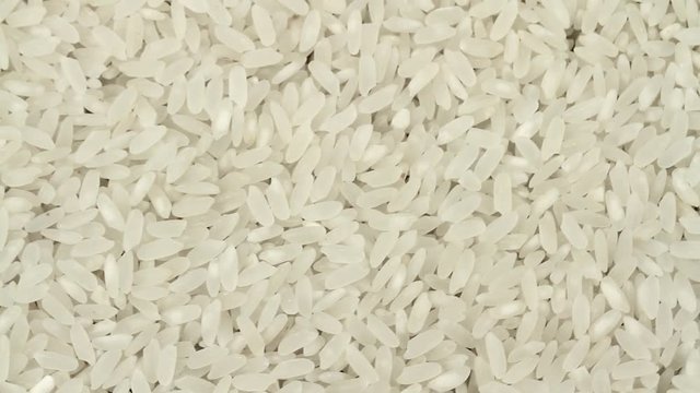 Uncooked white rice background.  1920x1080p HD video