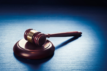 judge gavel on a blue wooden background