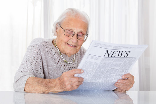 Senior Woman Reading Newspaper