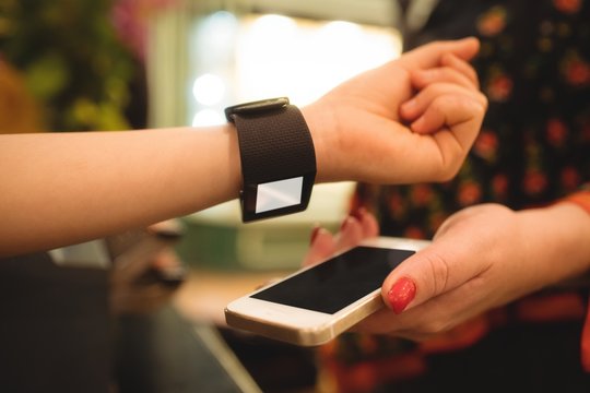 Hand making payment through smartwatch