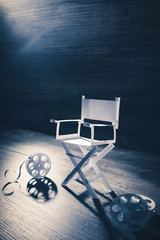 paper director chair on a blueish grey background