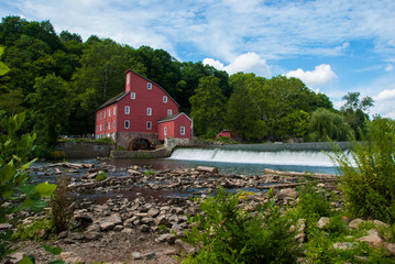 Red Mill beside a River - obrazy, fototapety, plakaty