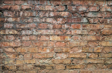 Old weathered red Brick wall. Vintage texture Background.