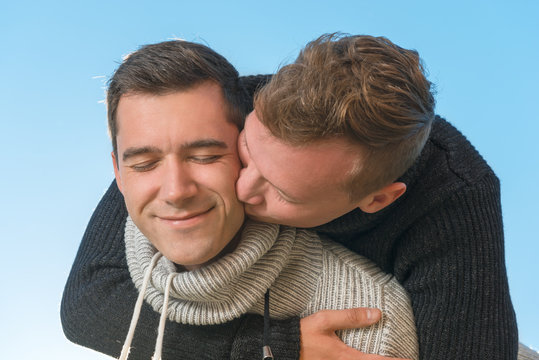 Hugs and kisses his boyfriend