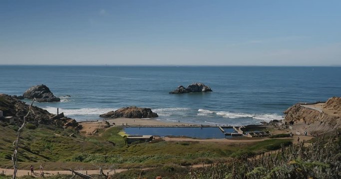 A daytime sunny establishing shot of Sutro Baths in San Francisco.  	