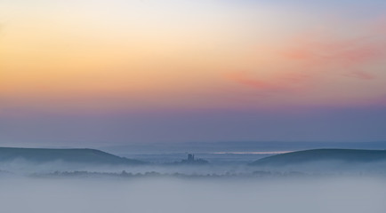 Rainbow skies in the Dorset Purbeck Hills above Corfe Castle